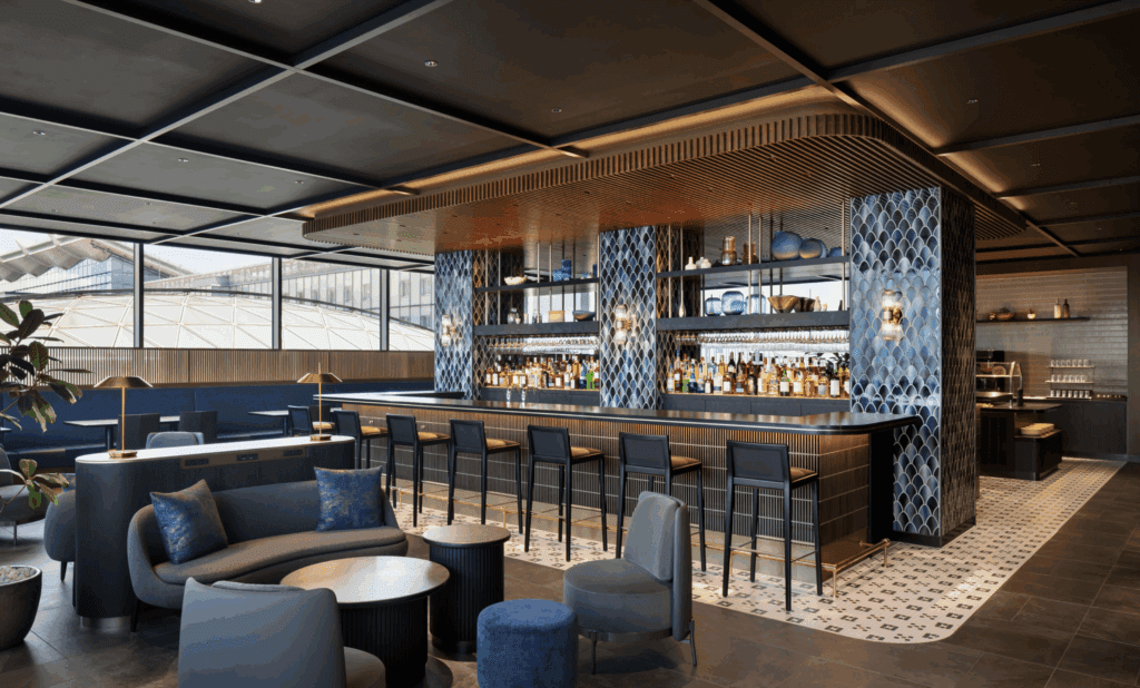 a bar with a counter and chairs